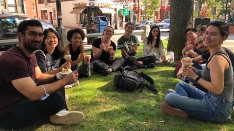 lab members eating gelato in the park