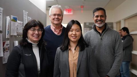 Jessica sun with her committee members after a successful defense.
